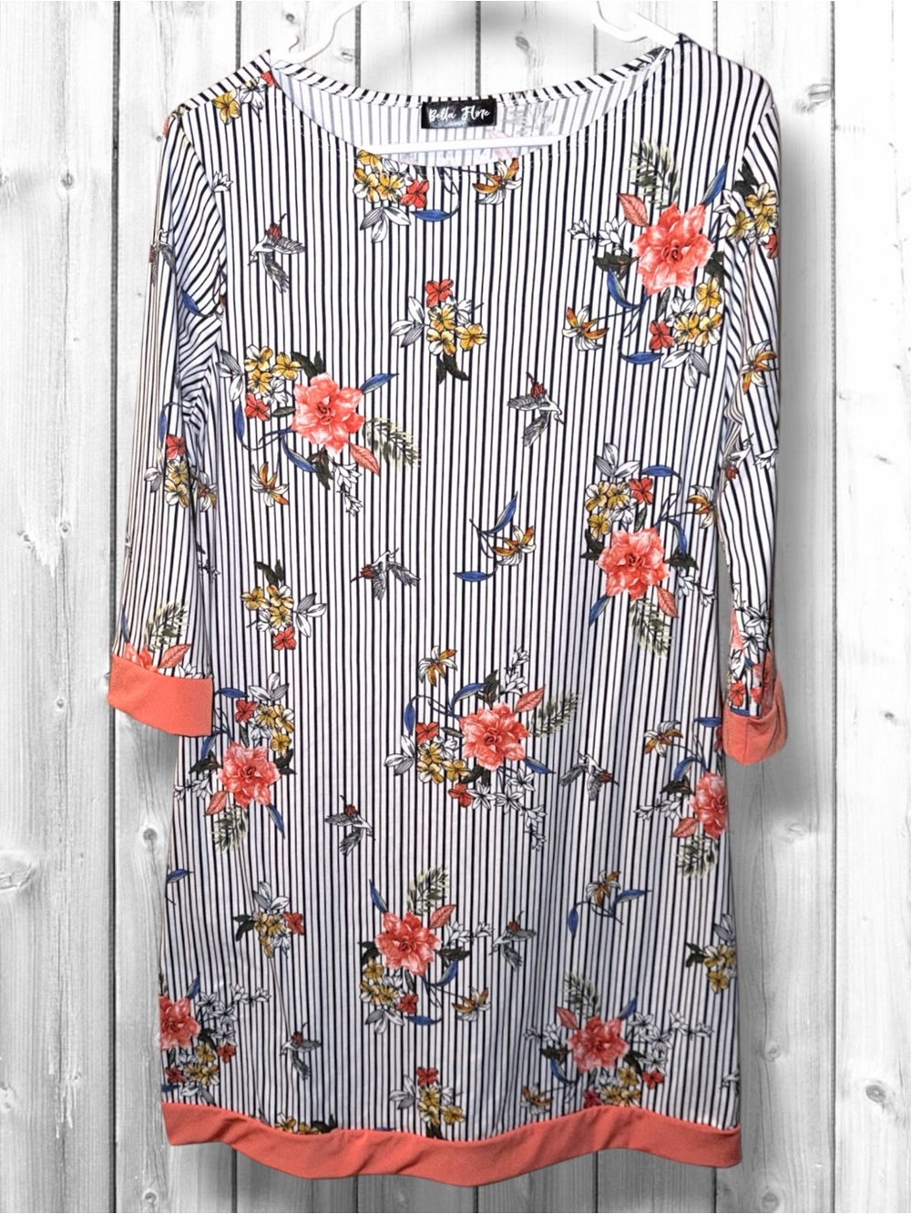 🌼Bella Flore tunic top features a black-and-white vertical pinstripe hummingbird